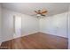 Bedroom featuring hardwood floors, ceiling fan, and closet at 3317 N 10Th Ave, Phoenix, AZ 85013