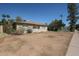 Single story brick house with desert landscaping and attached carport at 3317 N 10Th Ave, Phoenix, AZ 85013