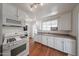 Bright kitchen features white cabinets, laminate countertops, and modern appliances at 3317 N 10Th Ave, Phoenix, AZ 85013
