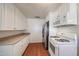 Bright kitchen features white cabinets, laminate countertops, and modern appliances at 3317 N 10Th Ave, Phoenix, AZ 85013