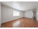 Spacious living room with hardwood floors, neutral walls, and bright natural light at 3317 N 10Th Ave, Phoenix, AZ 85013