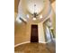 Dramatic entryway with tile floors, high ceilings, and chandelier at 3840 E San Mateo Way, Chandler, AZ 85249