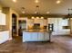 Spacious kitchen with stainless steel appliances, large island, and custom cabinetry at 3840 E San Mateo Way, Chandler, AZ 85249