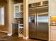 Gourmet kitchen with stainless steel refrigerator and built-in wine rack at 3840 E San Mateo Way, Chandler, AZ 85249
