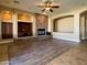 Bright living room boasts a stone fireplace, ceiling fan, and open layout, perfect for entertaining at 3840 E San Mateo Way, Chandler, AZ 85249