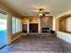 Bright living room with an exit door, stone fireplace, built-in cabinets, and natural light at 3840 E San Mateo Way, Chandler, AZ 85249