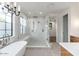 Beautiful bathroom featuring a soaking tub, walk-in shower with glass enclosure, and stylish modern lighting at 3913 E Campbell Ave, Phoenix, AZ 85018