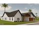 Charming single-story home featuring white siding, black trim, and a well-manicured front yard at 3913 E Campbell Ave, Phoenix, AZ 85018