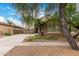 Charming home featuring a well-maintained lawn, desert landscaping, and a cozy two-story facade at 4254 S Winter Ln, Gilbert, AZ 85297