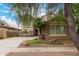 Charming home featuring a well-maintained lawn, desert landscaping, and a cozy two-story facade at 4254 S Winter Ln, Gilbert, AZ 85297