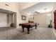 Spacious game room featuring a pool table, high ceilings, and an open floorplan at 4254 S Winter Ln, Gilbert, AZ 85297