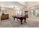 Spacious game room featuring a pool table, high ceilings, and natural light at 4254 S Winter Ln, Gilbert, AZ 85297