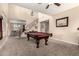 Spacious game room featuring a pool table, high ceilings, and an open floorplan at 4254 S Winter Ln, Gilbert, AZ 85297