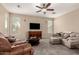 Cozy living room with plush sofas, a coffee table, and a large TV for relaxing at 4254 S Winter Ln, Gilbert, AZ 85297