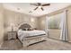 Relaxing main bedroom boasts neutral walls, carpeted floor, and a king bed with bench at the foot at 4254 S Winter Ln, Gilbert, AZ 85297