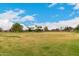 Expansive grassy park with mature trees and recreation areas in a residential area at 4254 S Winter Ln, Gilbert, AZ 85297