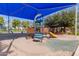 Shaded community playground equipped with various play structures for children at 4254 S Winter Ln, Gilbert, AZ 85297