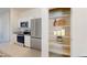 Well-equipped kitchen with stainless steel appliances and a walk-in pantry at 47165 W Coe St, Maricopa, AZ 85139