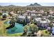Aerial view of the condominium complex surrounded by lush landscaping and a serene lake at 5124 N 31St Pl # 514, Phoenix, AZ 85016