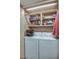 Functional laundry room with a washer, dryer, and built-in shelving, offering convenient space for laundry tasks at 5124 N 31St Pl # 514, Phoenix, AZ 85016