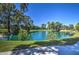 Beautiful serene pond surrounded by mature trees and lush greenery creating a peaceful setting at 5124 N 31St Pl # 514, Phoenix, AZ 85016