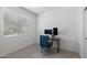 Well-lit bedroom featuring a desk area with dual monitors, perfect for a home office setup at 5429 W Chuck Box Rd, Laveen, AZ 85339