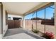 Spacious covered patio area with a concrete floor and an open view of the backyard at 5429 W Chuck Box Rd, Laveen, AZ 85339