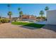 Spacious backyard featuring a pool, pergola, and palm trees at 5525 E Waltann Ln, Scottsdale, AZ 85254