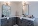 Bathroom with dual vanities, black fixtures, marble countertops, and stylish mirrors, creating a modern and functional space at 5525 E Waltann Ln, Scottsdale, AZ 85254