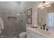 Bathroom featuring a glass-enclosed shower, a built-in niche, and a vanity with marble countertops at 5525 E Waltann Ln, Scottsdale, AZ 85254