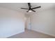 Bedroom featuring neutral carpet and paint, and a ceiling fan at 5525 E Waltann Ln, Scottsdale, AZ 85254