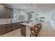 Eat-in kitchen with a spacious island, stainless steel appliances, breakfast bar, and contemporary design at 5525 E Waltann Ln, Scottsdale, AZ 85254