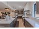 Bright kitchen featuring a large island, stainless steel appliances, and sleek countertops at 5525 E Waltann Ln, Scottsdale, AZ 85254