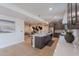 Open concept kitchen with stainless steel appliances, kitchen island with seating and stylish pendant lighting at 5525 E Waltann Ln, Scottsdale, AZ 85254