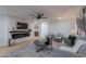 Cozy living room with a fireplace, comfortable seating, and stylish decor at 5525 E Waltann Ln, Scottsdale, AZ 85254