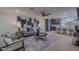 Stylish living room with modern furniture, artwork, and an open layout to the kitchen at 5525 E Waltann Ln, Scottsdale, AZ 85254