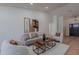 Comfortable living room with plush seating, modern art, and ample natural light at 5525 E Waltann Ln, Scottsdale, AZ 85254