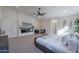 Cozy main bedroom with a fireplace, accent chairs, and soft, inviting decor at 5525 E Waltann Ln, Scottsdale, AZ 85254