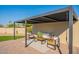 Inviting outdoor pergola with stylish seating and a cozy rug for relaxation at 5525 E Waltann Ln, Scottsdale, AZ 85254