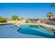 Backyard pool area with modern pergola, artificial turf, and palm trees at 5525 E Waltann Ln, Scottsdale, AZ 85254