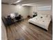 Cozy bedroom featuring a bed, desk, and wood-look flooring at 5833 N 10Th St, Phoenix, AZ 85014