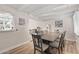 Dining room with a view, featuring hardwood floors and adjacent sitting area and kitchen at 5833 N 10Th St, Phoenix, AZ 85014