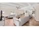 Open-concept living room with sleek furniture, hardwood floors, and abundant natural light at 5833 N 10Th St, Phoenix, AZ 85014