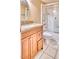 Bathroom with granite countertop vanity and shower-tub combination at 6885 E Cochise Rd # 129, Paradise Valley, AZ 85253