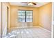 Bright bedroom featuring tile flooring, neutral walls, and a large window for natural light at 6885 E Cochise Rd # 129, Paradise Valley, AZ 85253