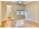 Bright bedroom with hardwood floors, closet, a window and neutral paint color at 6885 E Cochise Rd # 129, Paradise Valley, AZ 85253