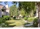 Serene community green space with trees, manicured lawn, and walkways, offering a peaceful retreat at 6885 E Cochise Rd # 129, Paradise Valley, AZ 85253