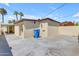 Backyard with laundry area, concrete slab, and a large blue trash receptacle at 701 W Windsor Ave, Phoenix, AZ 85007