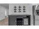 Elegant bar area with wine rack and wine cooler beside stainless fridge at 701 W Windsor Ave, Phoenix, AZ 85007