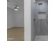 Elegant bathroom and bedroom view, showcasing tiled shower with niche and modern fixtures at 701 W Windsor Ave, Phoenix, AZ 85007